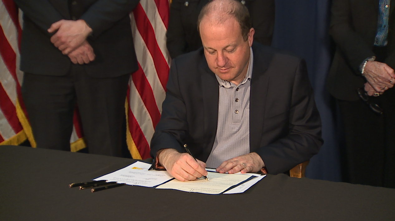 Polis signs school safety bills April 27 2023