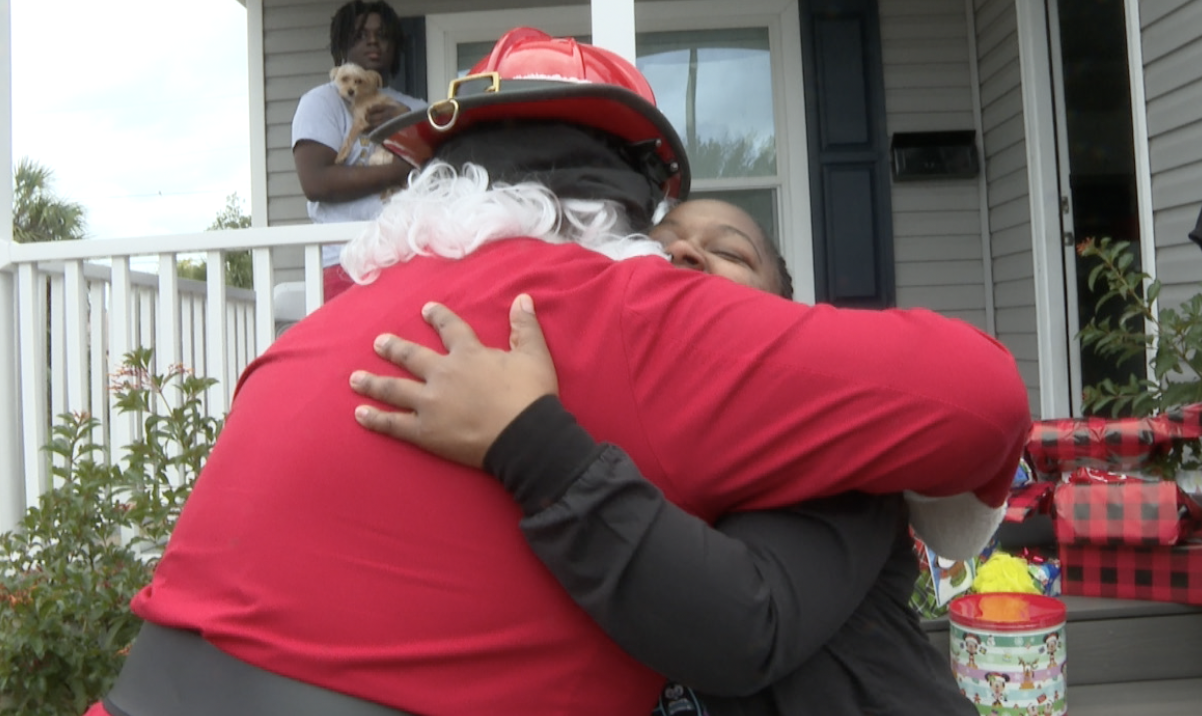 St. Pete Fire Rescue and Santa deliver gifts to fire victims