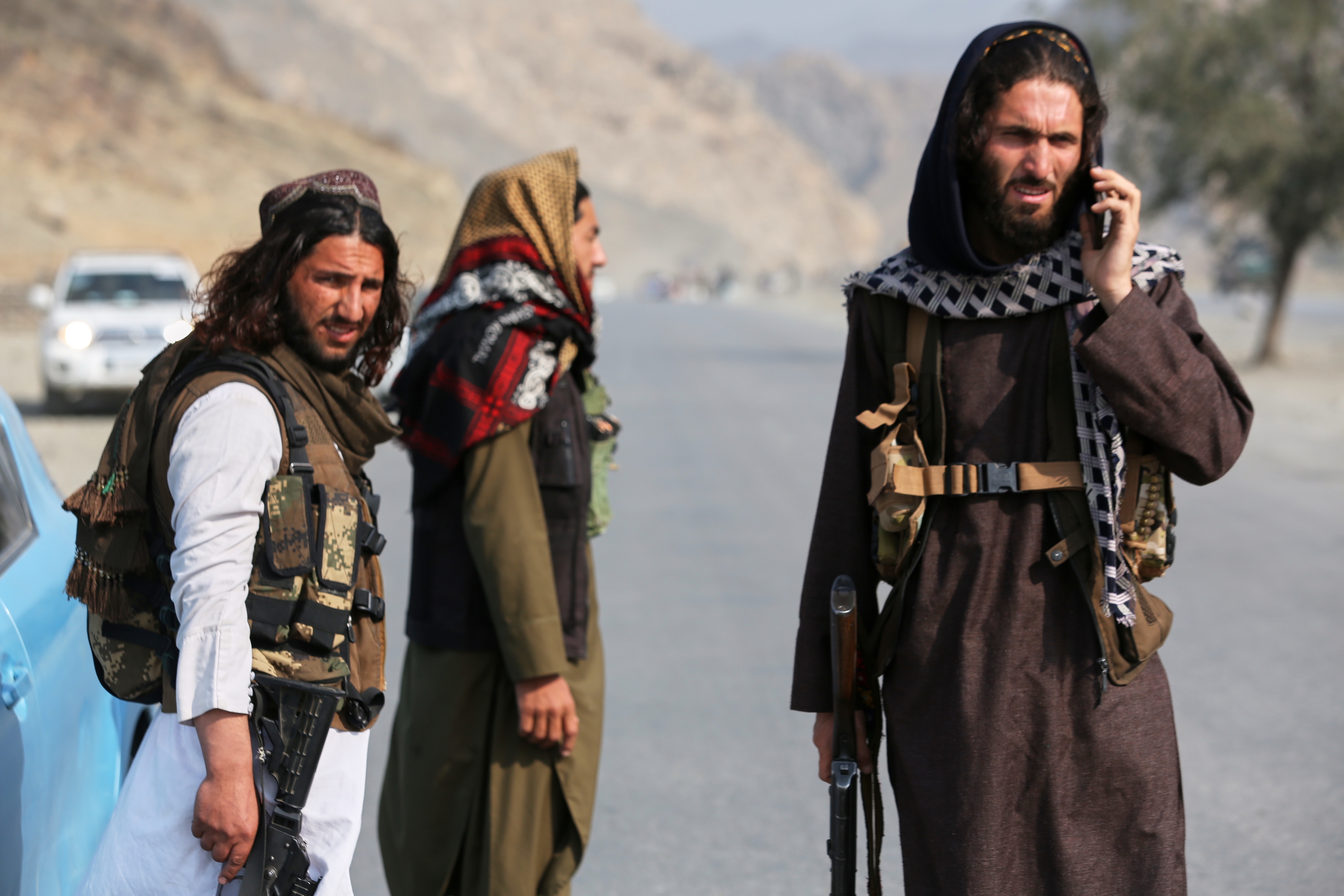 Afghan Taliban soldiers stand on the Afghan side of the Torkham border crossing with Pakistan in Torkham, Afghanistan, Friday, Feb. 27, 2026.