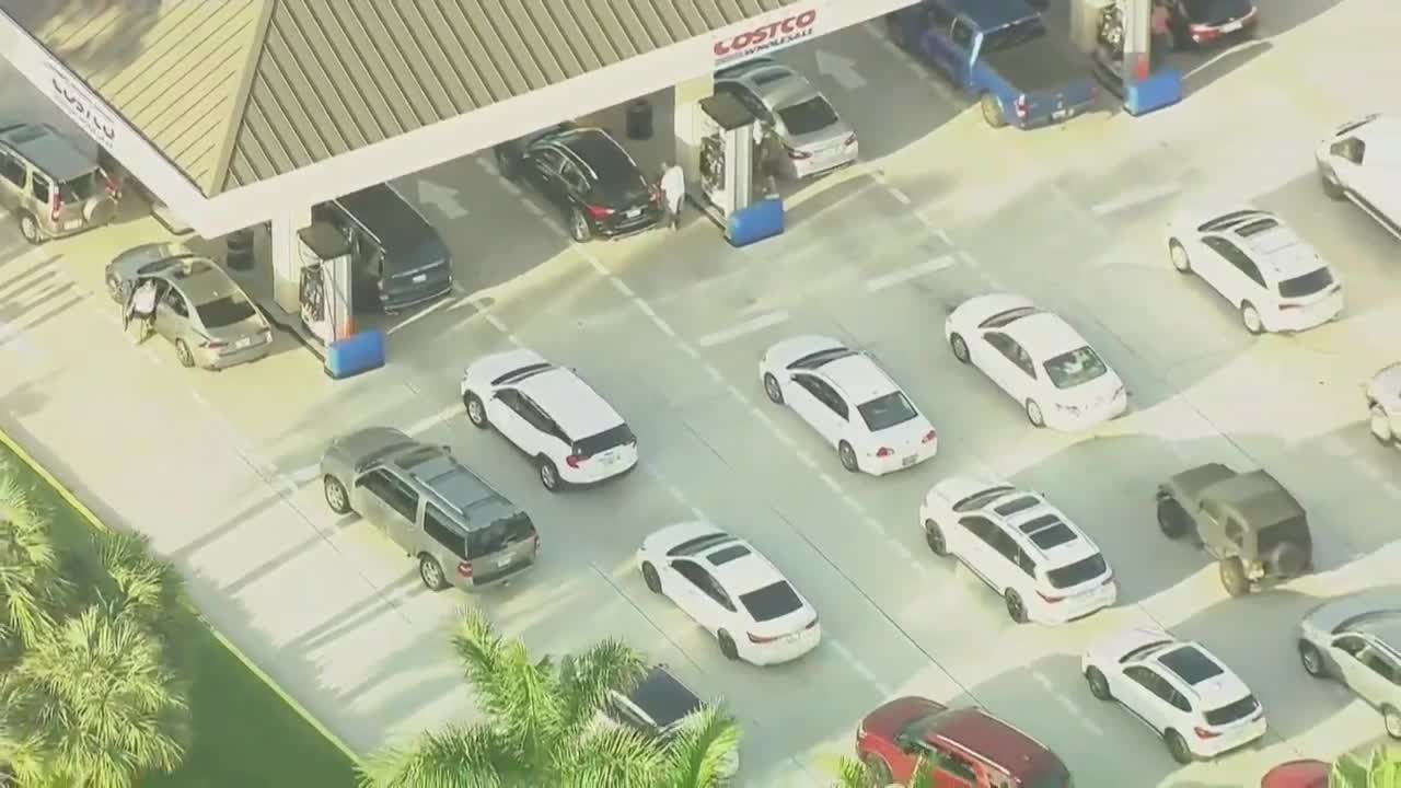 vehicles line up for gas at Costco in North Palm Beach, May 12, 2021