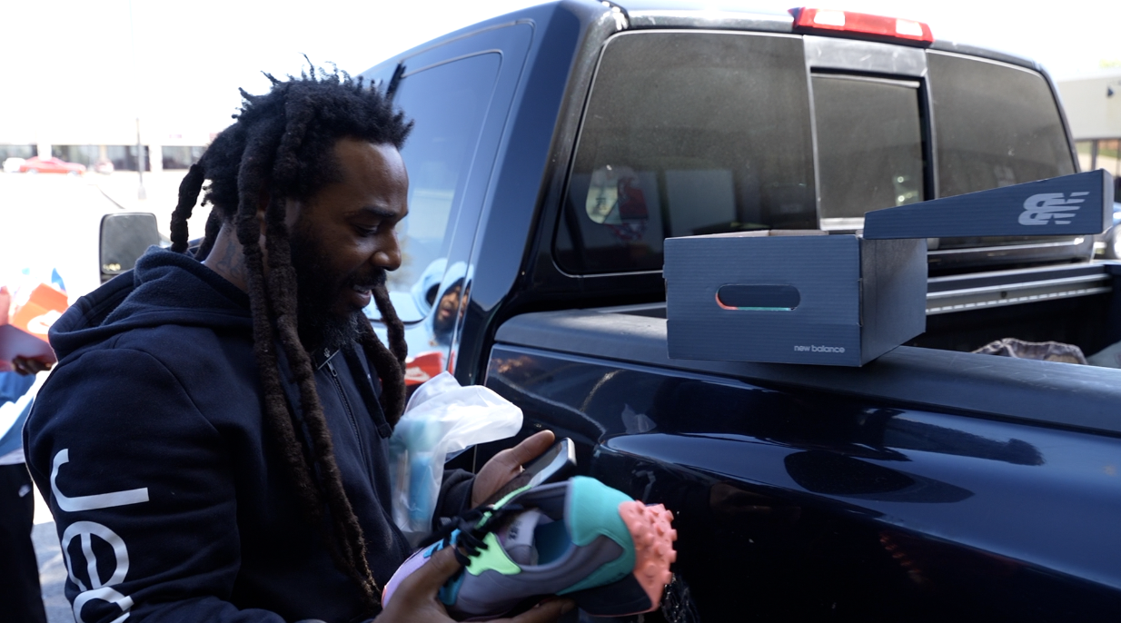 Ray Hill with donated shoes