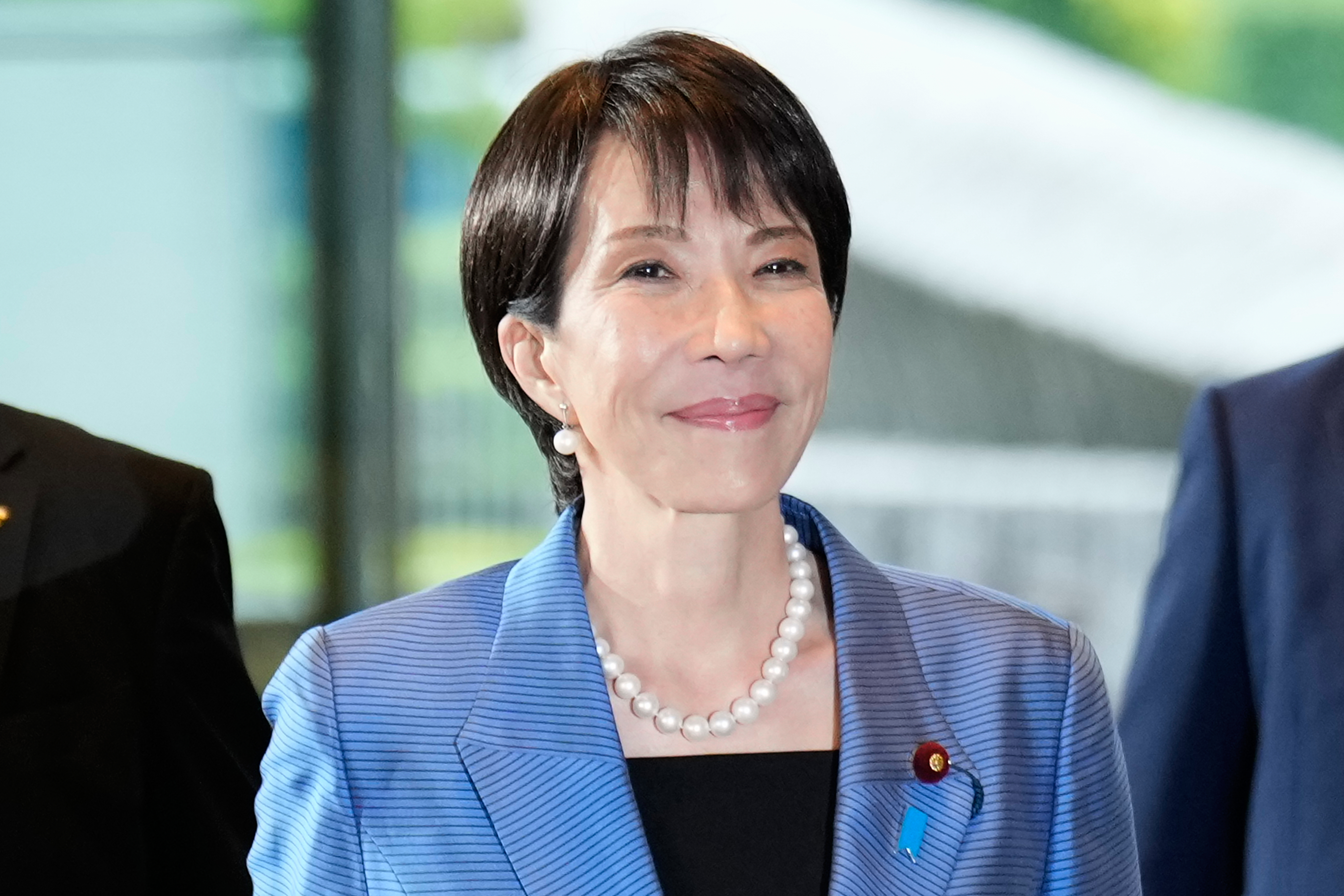 Newly elected Prime Minister Sanae Takaichi arrives at the prime minister's office in Tokyo, Japan, Tuesday, Oct. 21, 2025.