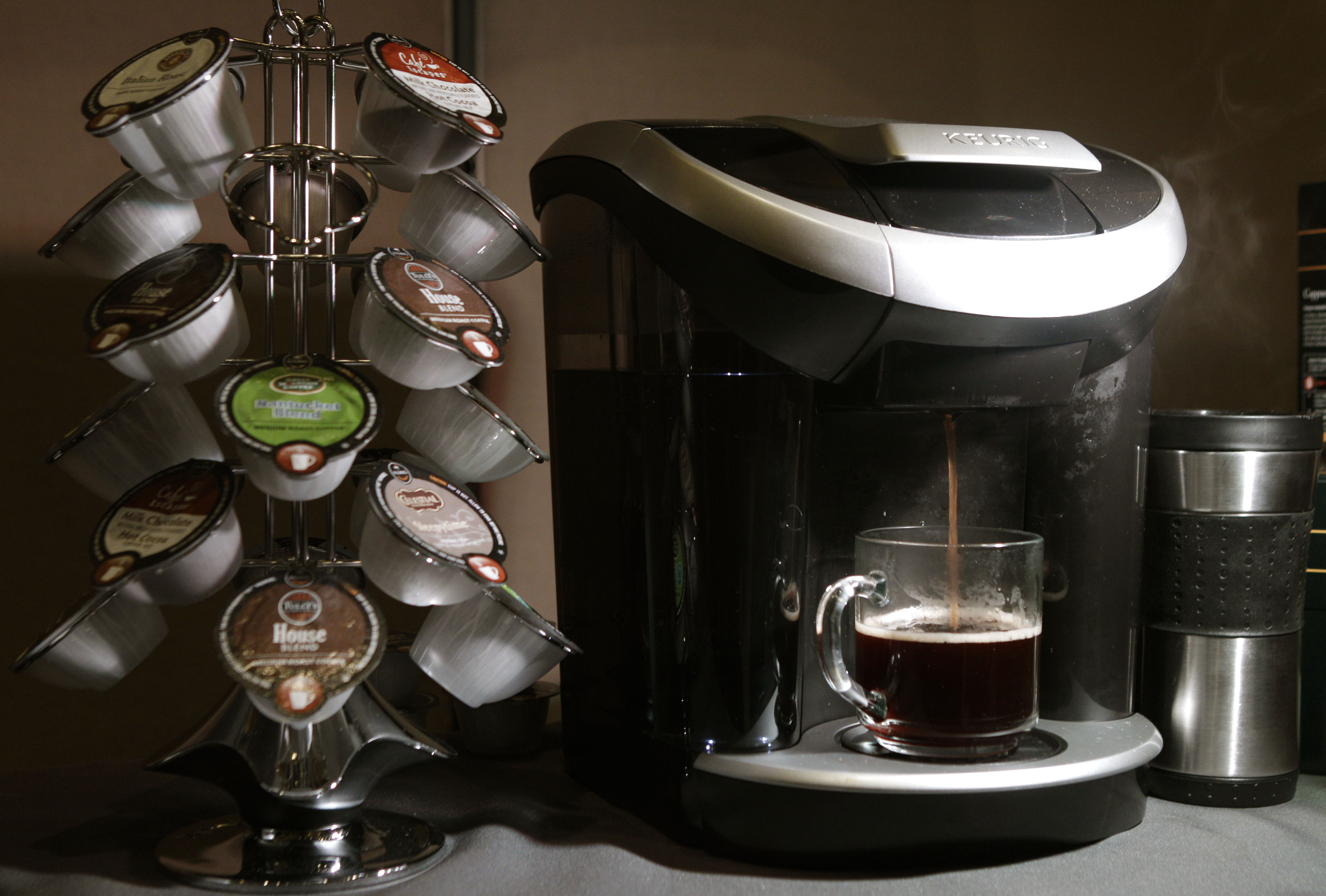 Keurig's Vue individual coffee roasting system is displayed during a Green Mountain Coffee Roasters news conference in New York, Wednesday, Feb. 15, 2012.  The coffee machine can also prepare frothy hot beverages as well as iced drinks. 