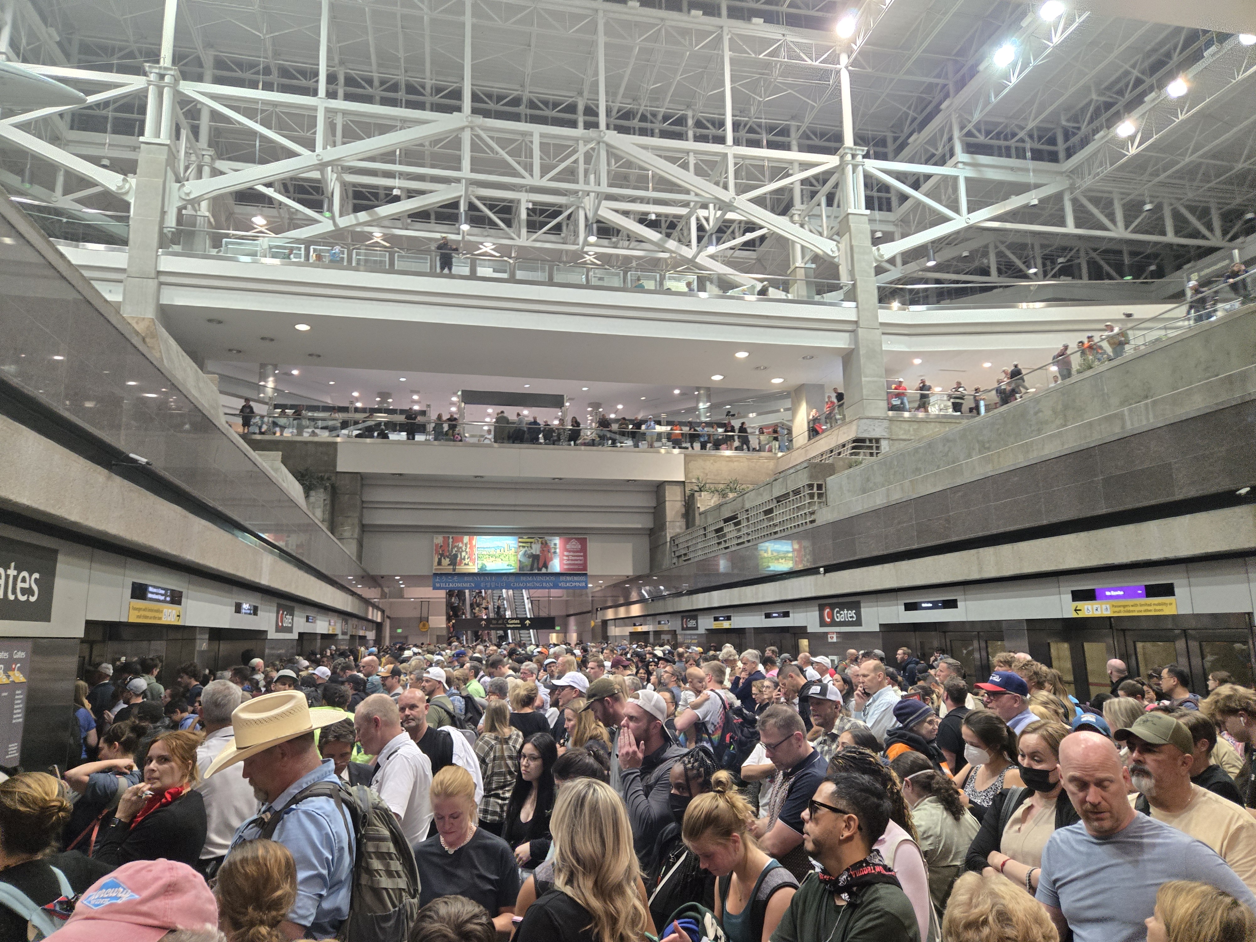 Denver International Airport train platform packed with passengers during delay late Tuesday night