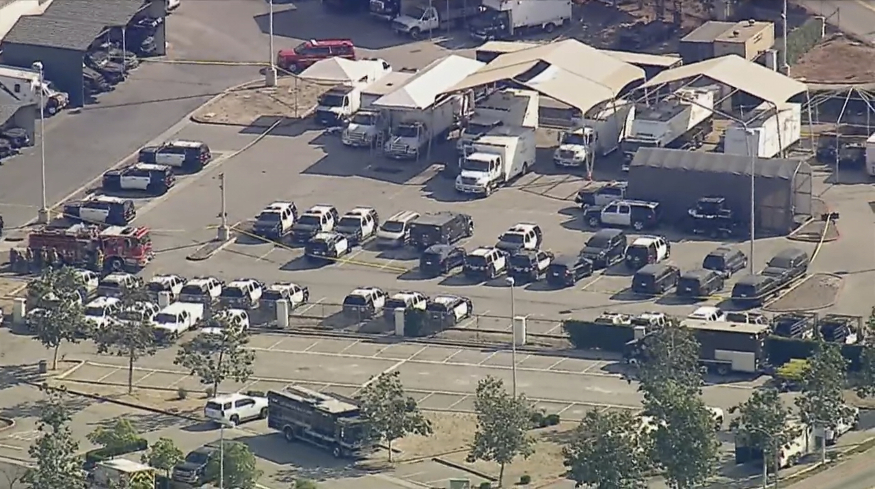 Police and emergency vehicles are in place at the scene of a blast at the Biscailuz Center Training Academy in East Los Angeles on Friday, July 18, 2025.  