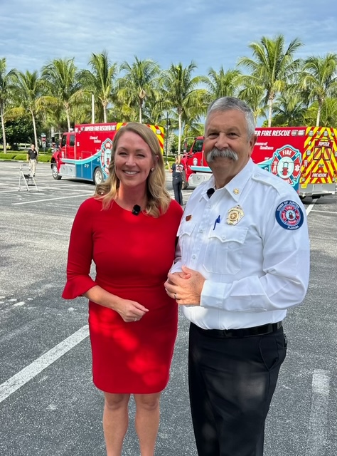 Ashley Glass connecting with Jupiter Fire Chief