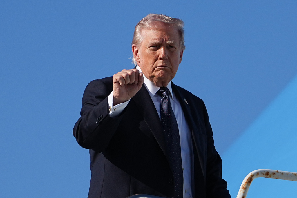 President Donald Trump gestures as he boards Air Force One at Palm Beach International Airport, Sunday, March 1, 2026, in West Palm Beach, Fla.