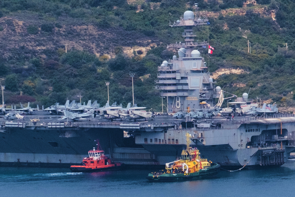 The USS Gerald R. Ford aircraft carrier is docked at Souda Naval Base near Chania on the island of Crete, Monday, March 23, 2026.