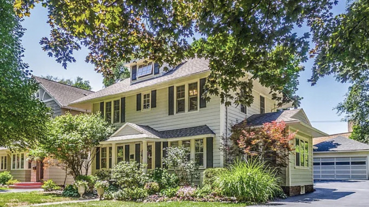 A center-entrance colonial-style home.