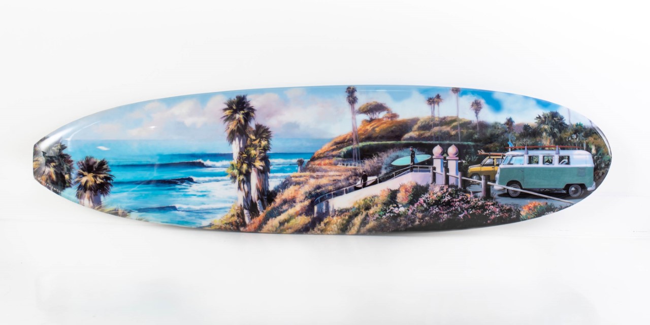 Artist Wade Koniakowsky displays surfboard for grand opening of Art Alley in Solana Beach. 