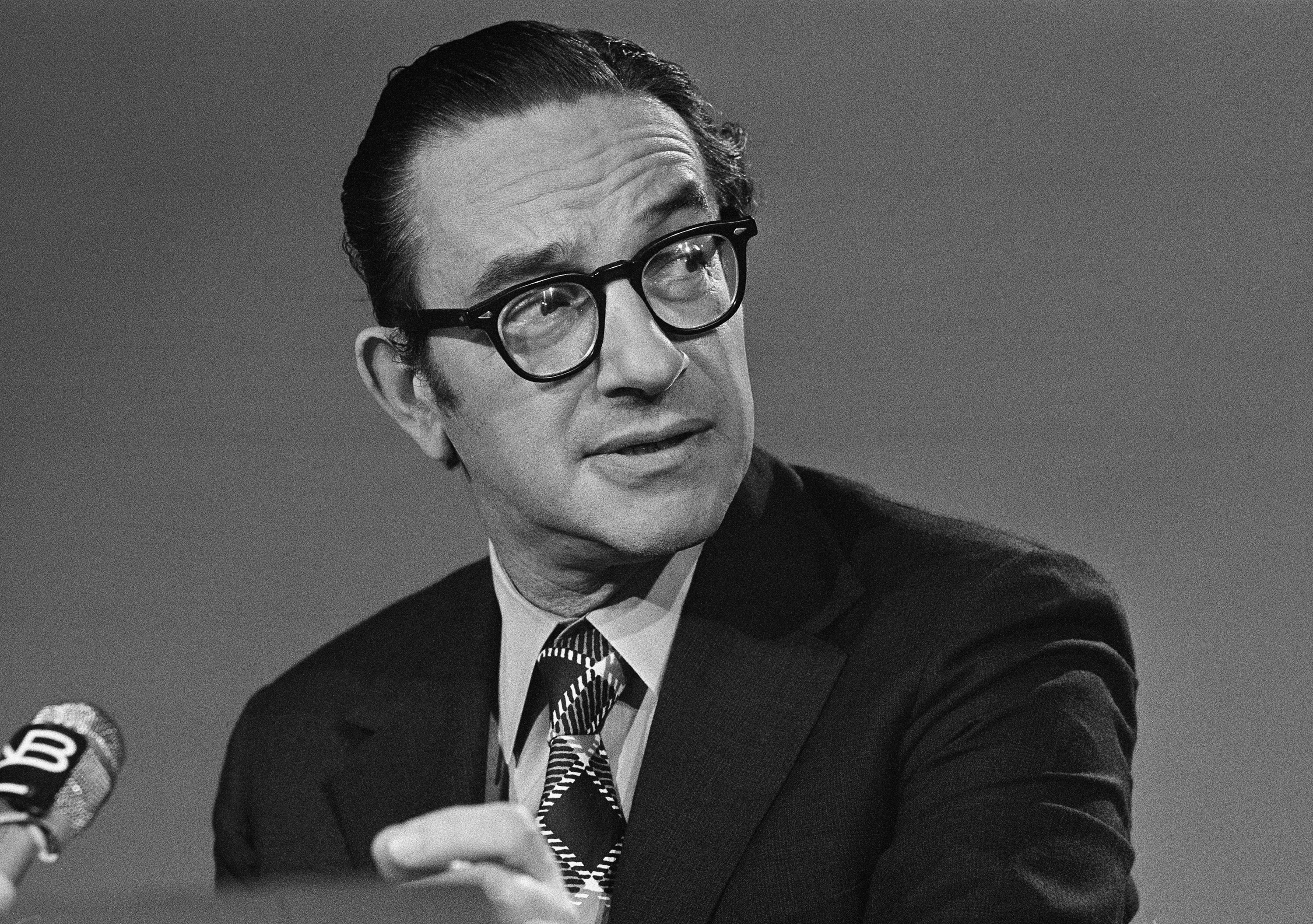 Alan Greenspan chairman of the Council of Economic Advisers, chats with newsmen prior to his appearance on NBC's "Meet the Press", Sept. 29, 1974, in Washington.