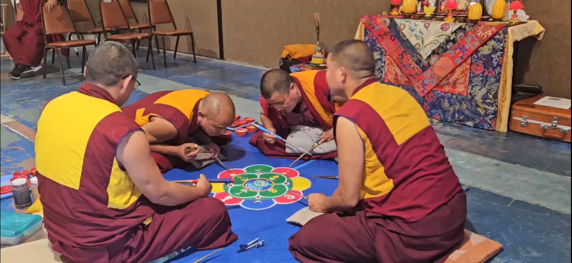 Drepung Gomang Monastery Monks make a sand mandala