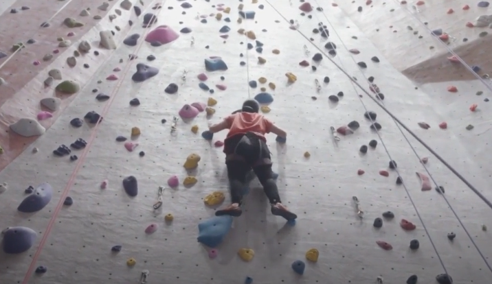 woman climbing in gym
