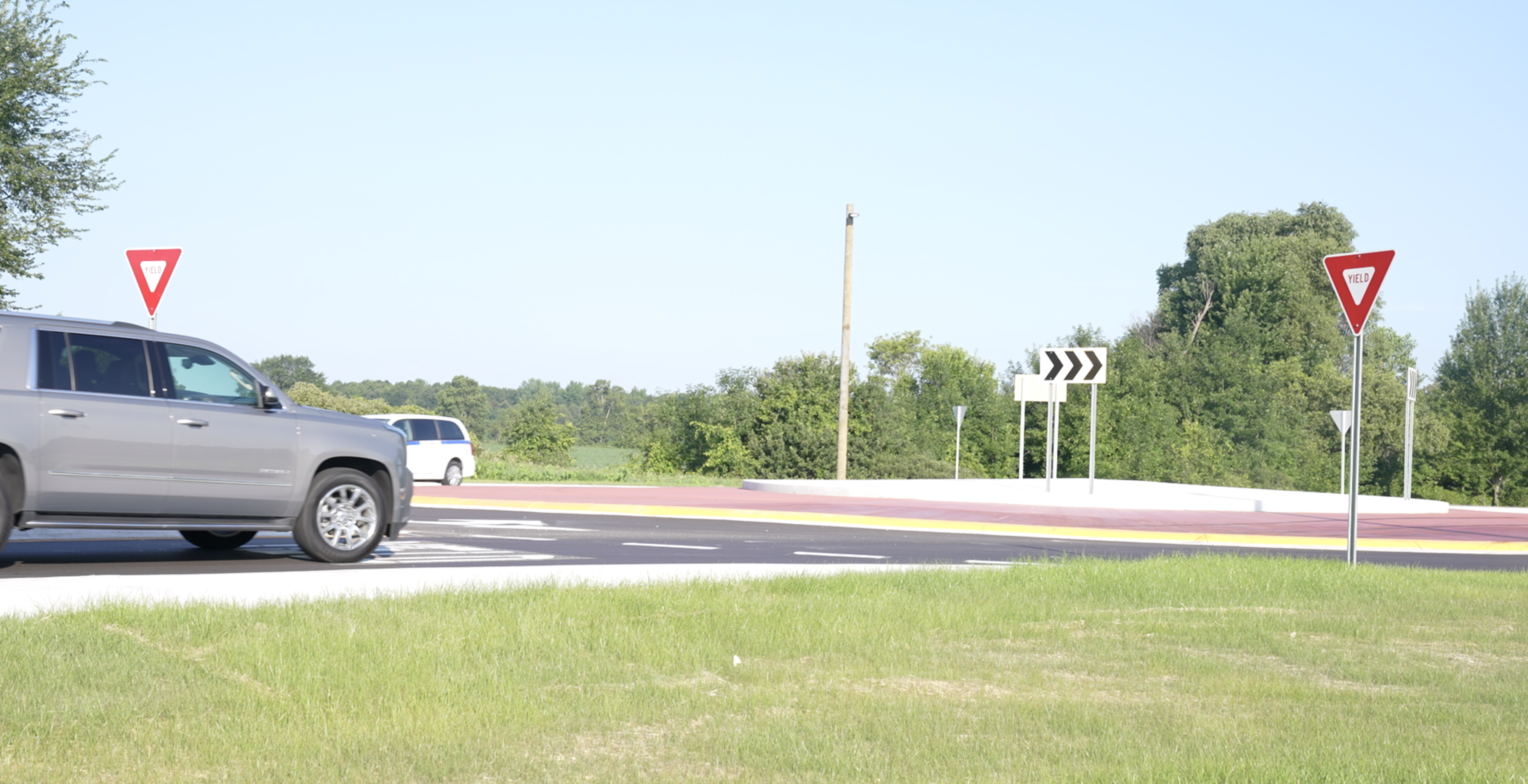 Cars are going through the roundabout 