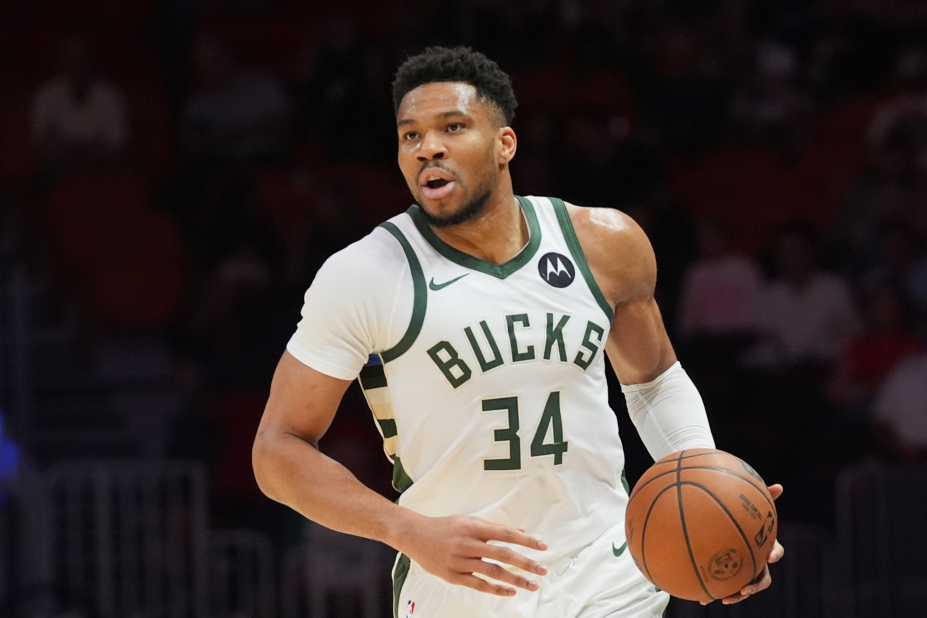 Milwaukee Bucks forward Giannis Antetokounmpo (34) dribbles the ball during the first half of an NBA basketball game.