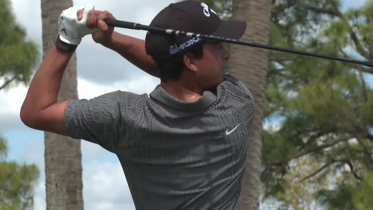 Fred Biondi watches after teeing off on green during 2024 Cognizant Classic pro-am