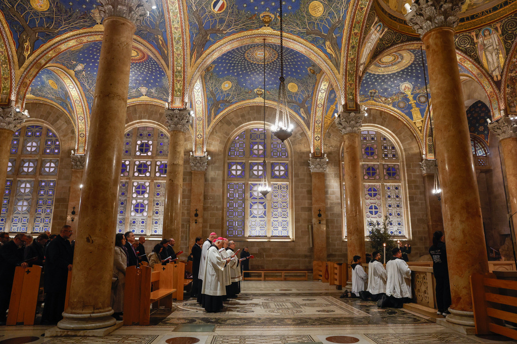 Faithful attend a prayer service in the Church of All Nations, held by Cardinal Pierbattista Pizzaballa, the Latin Patriarch of Jerusalem, to mark Palm Sunday in Jerusalem, Sunday, March 29, 2026.