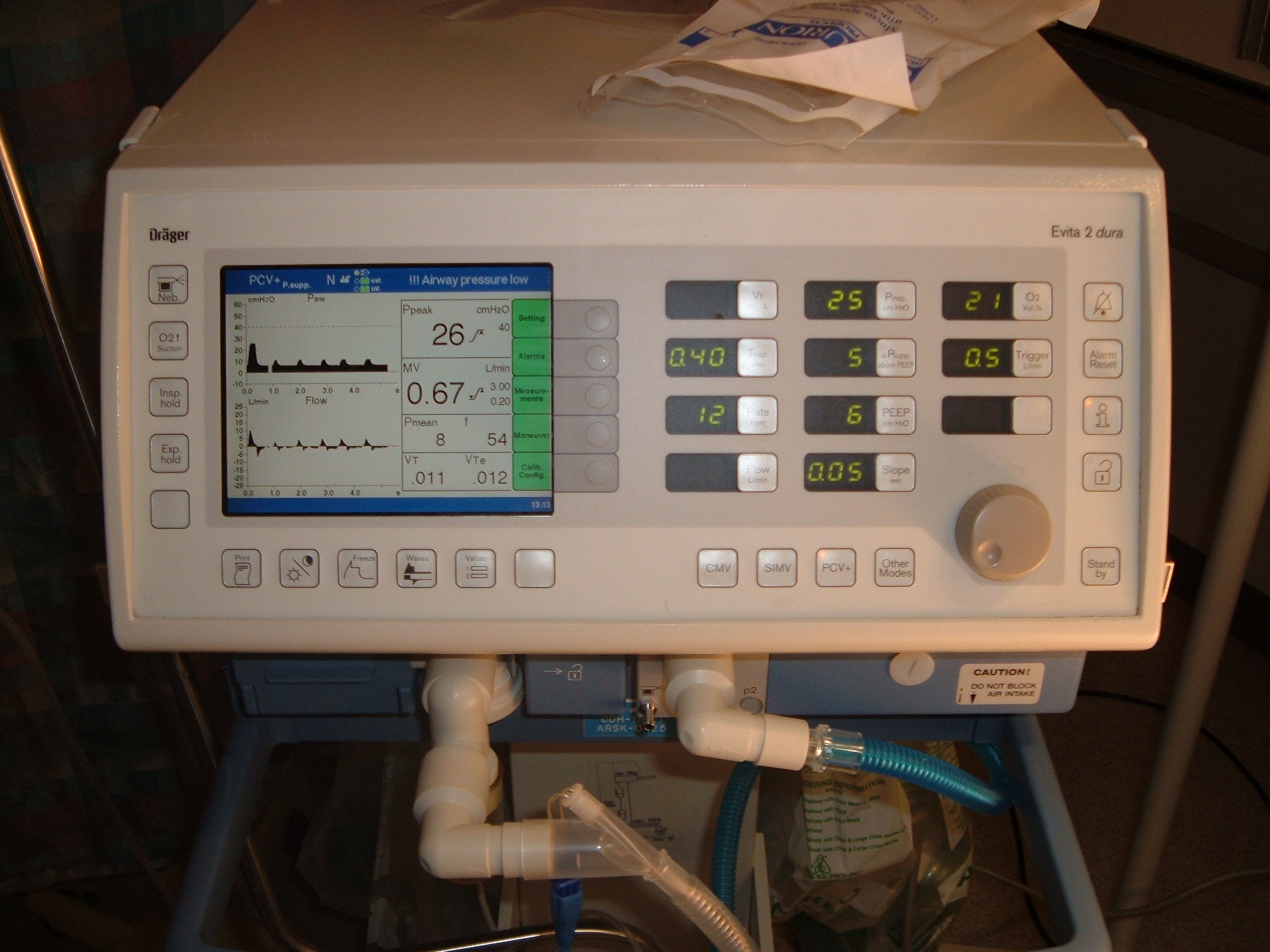 Mechanical ventilator in a hospital room