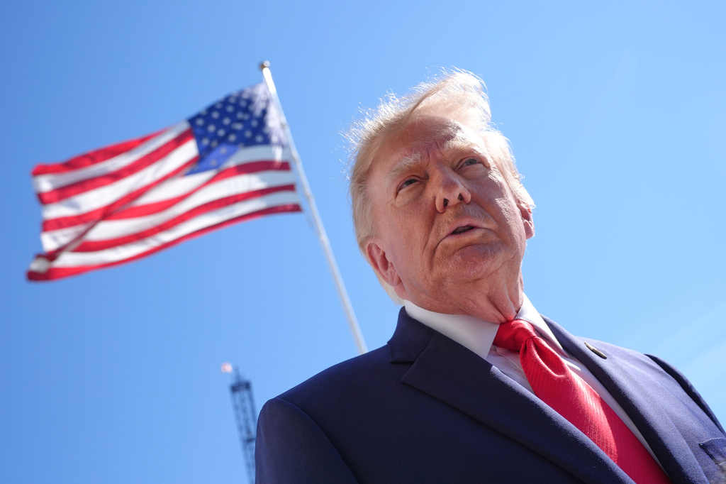 President Donald Trump listens to a question from a reporter before boarding Marine One on the South Lawn of the White House, Thursday Oct. 1, 2026, in Washington. 