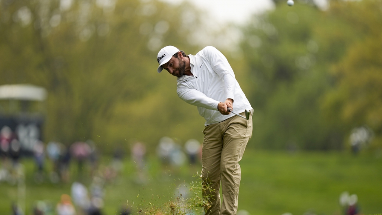 Braden Shattuck hits from the rough on the fourth hole during a practice around for the PGA Championship golf tournament.