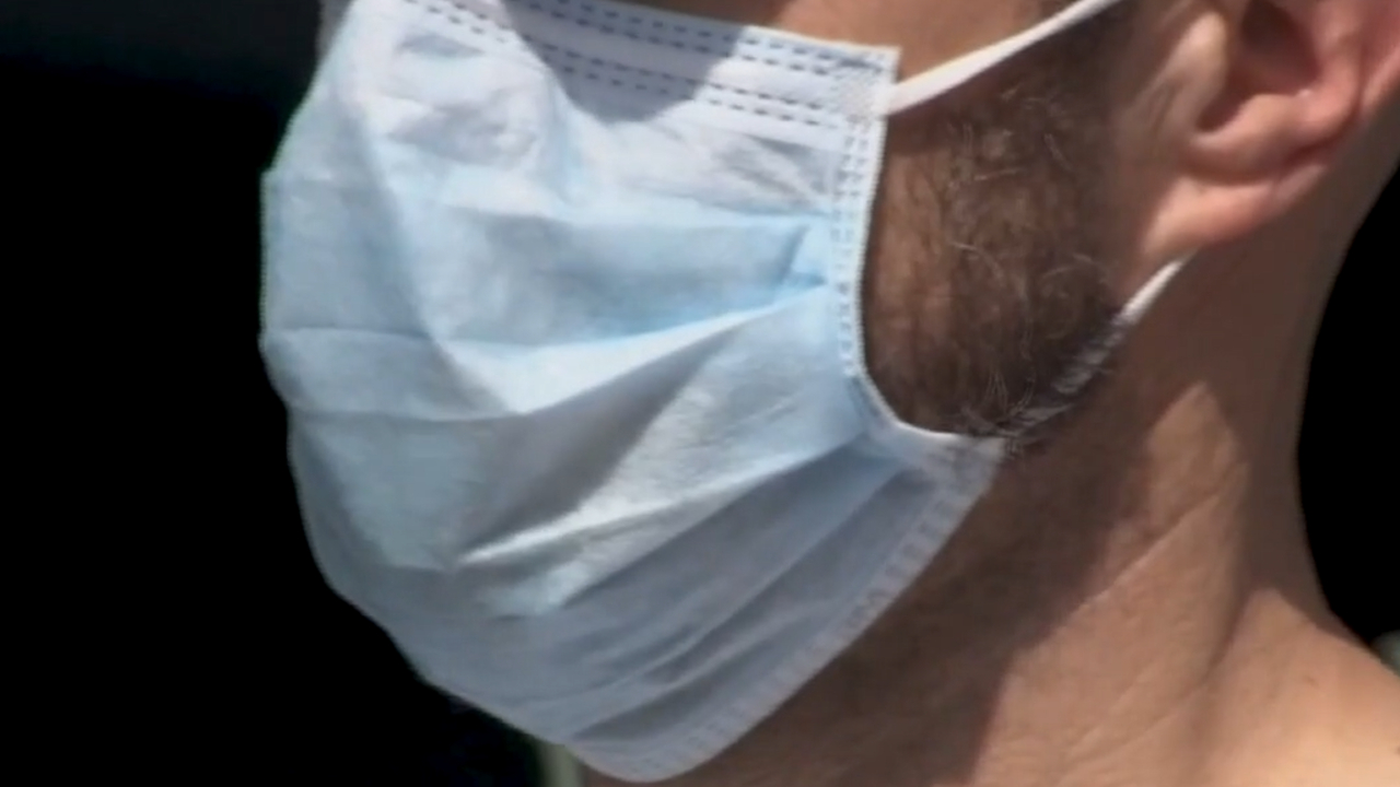 File photo of a resident wearing a mask in Palm Beach County.jpg