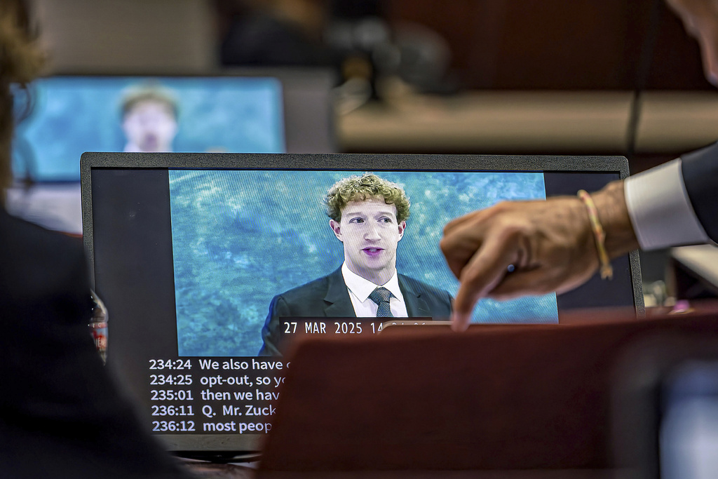 Lawyers for the plaintiff watch on a laptop as a recording of Meta Founder and CEO Mark Zuckerberg's deposition is played for the jurors on Wednesday, March 4, 2026, in Santa Fe, N.M.