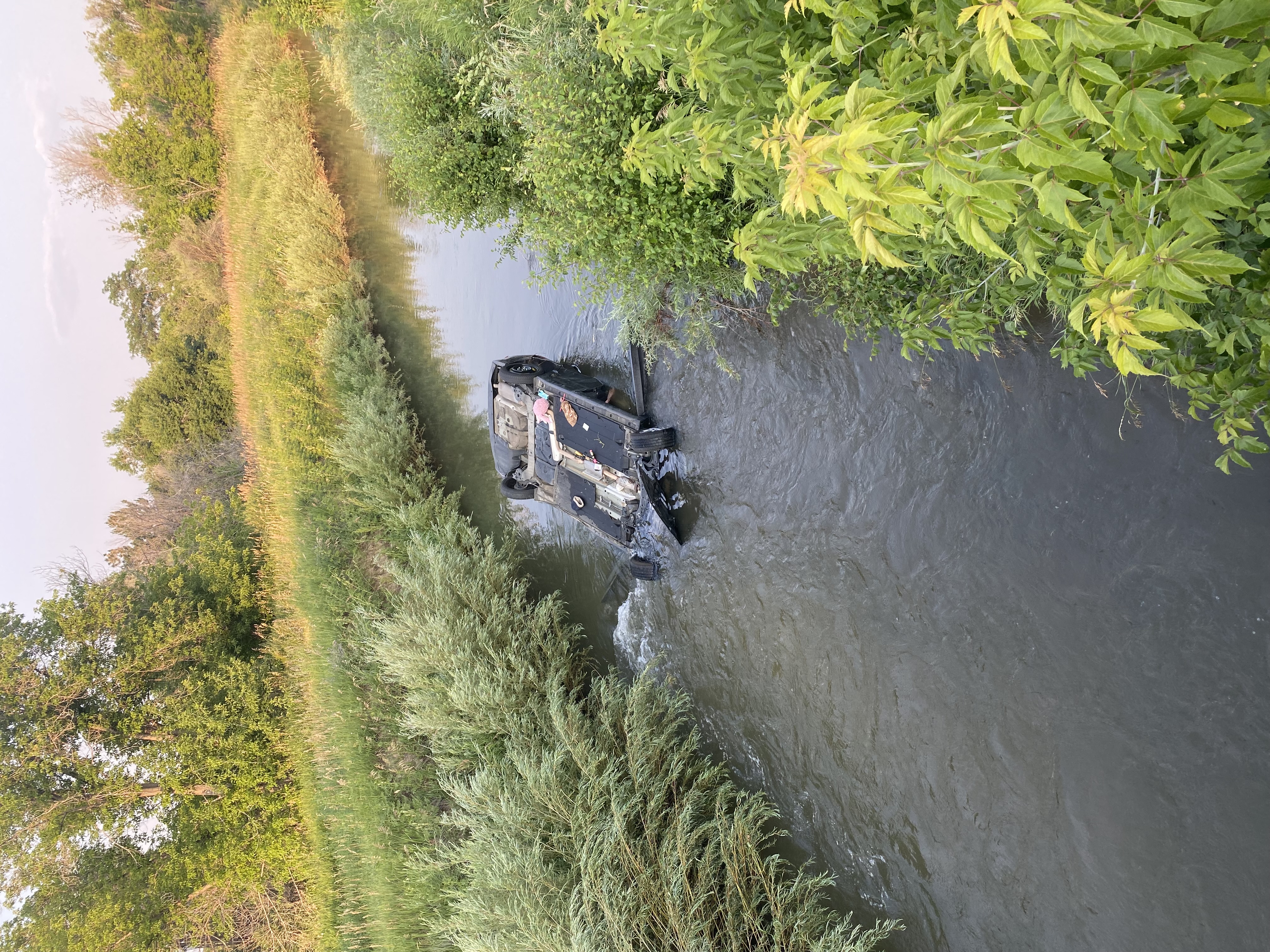 Car submerged in canal in Arvada