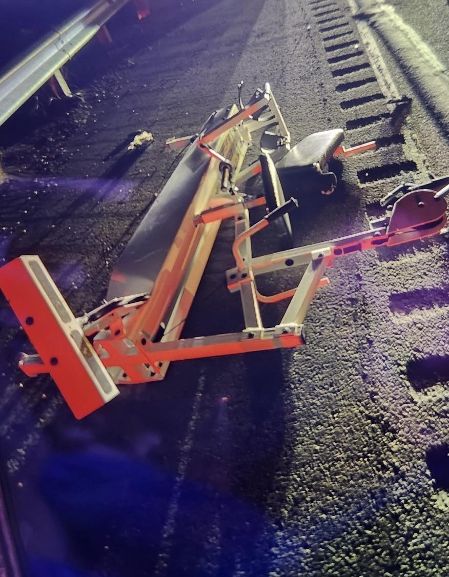 A photo from the scene released by the Beaver Dam-Littleton Fire Department. The exercise equipment is strewn about the road, visibly damaged.