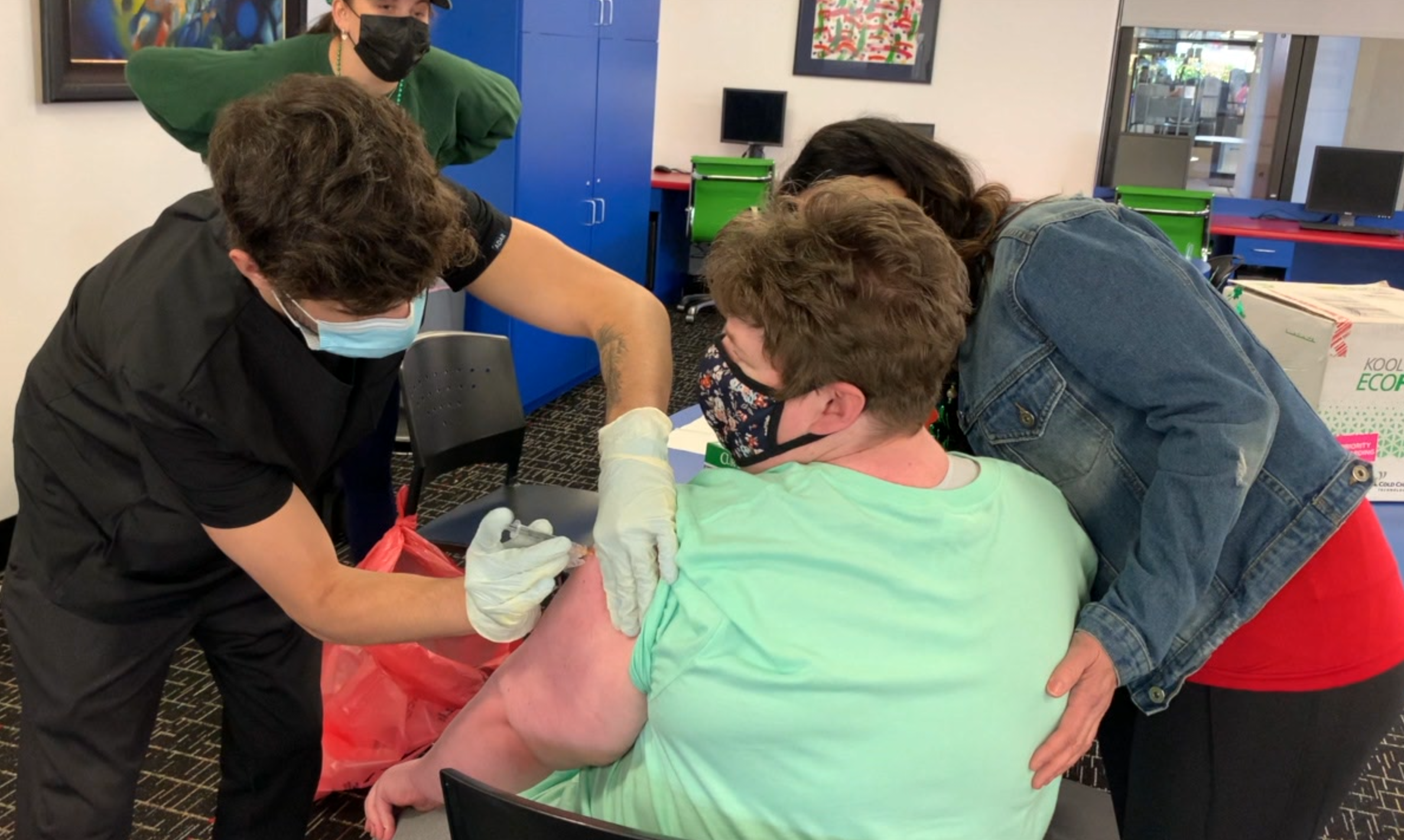 Families in adult care program receive first COVID-19 vaccine on St. Patrick's day 