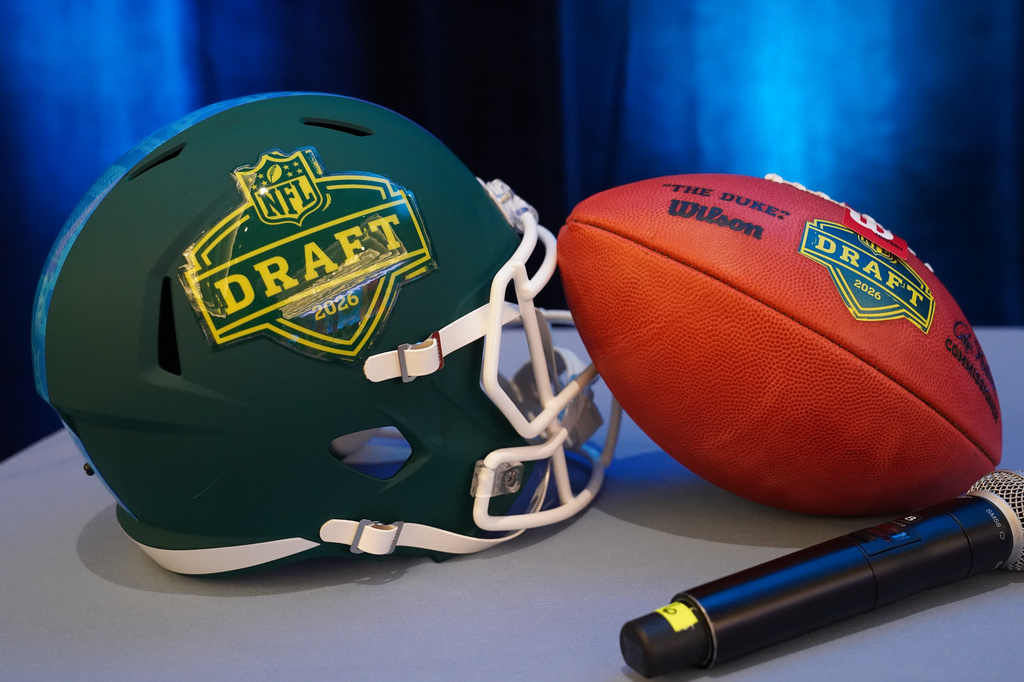 Football helmet and ball during the Prospect to Pro Family Panel event ahead of the NFL draft in Pittsburgh, Wednesday, April 22, 2026.