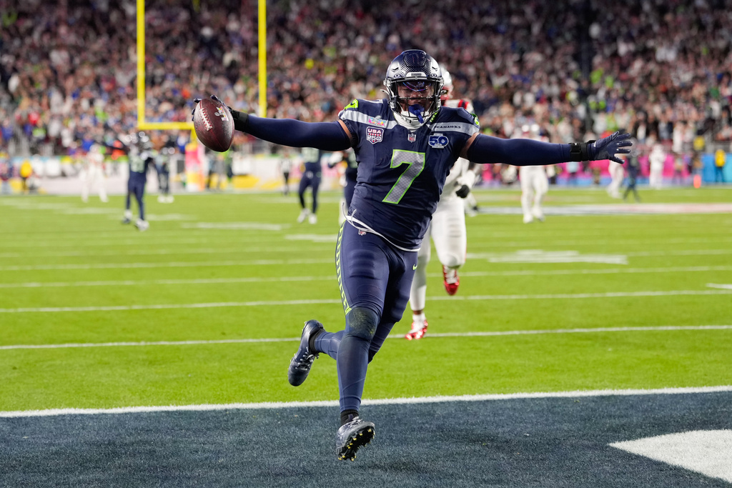 Seattle Seahawks linebacker Uchenna Nwosu (7) celebrates his touchdown on a fumble recovery during the second half of the NFL Super Bowl 60 football game against the New England Patriots, Sunday, Feb. 8, 2026, in Santa Clara, Calif. 