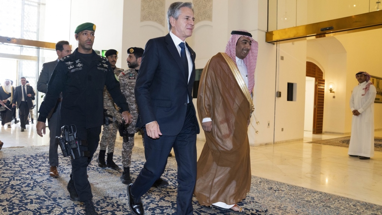 U.S. Secretary of State Antony Blinken, center, arrives to meet with Saudi Foreign Minister Prince Faisal bin Farhan