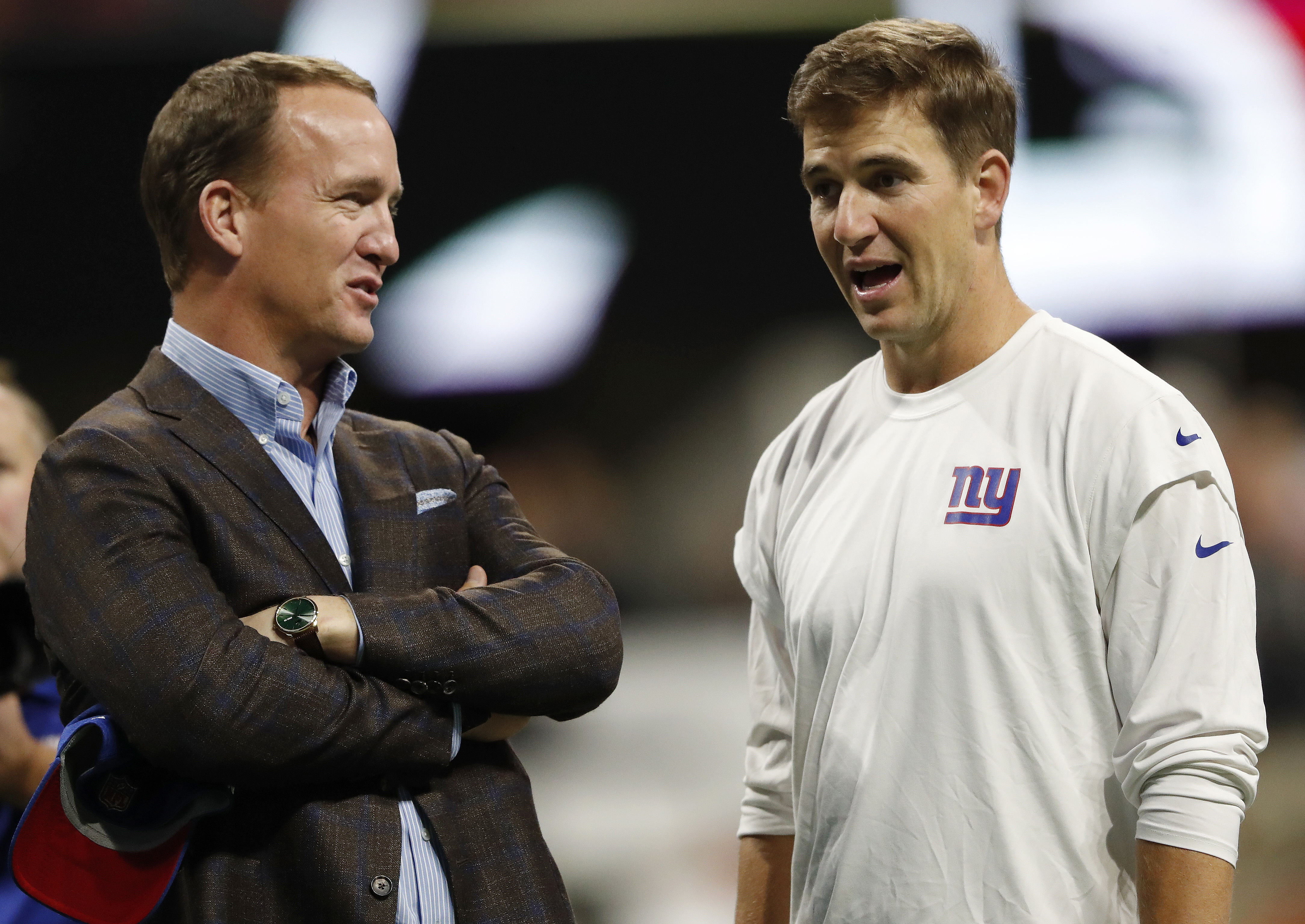 FILE Peyton Manning, Eli Manning Giants Falcons Football