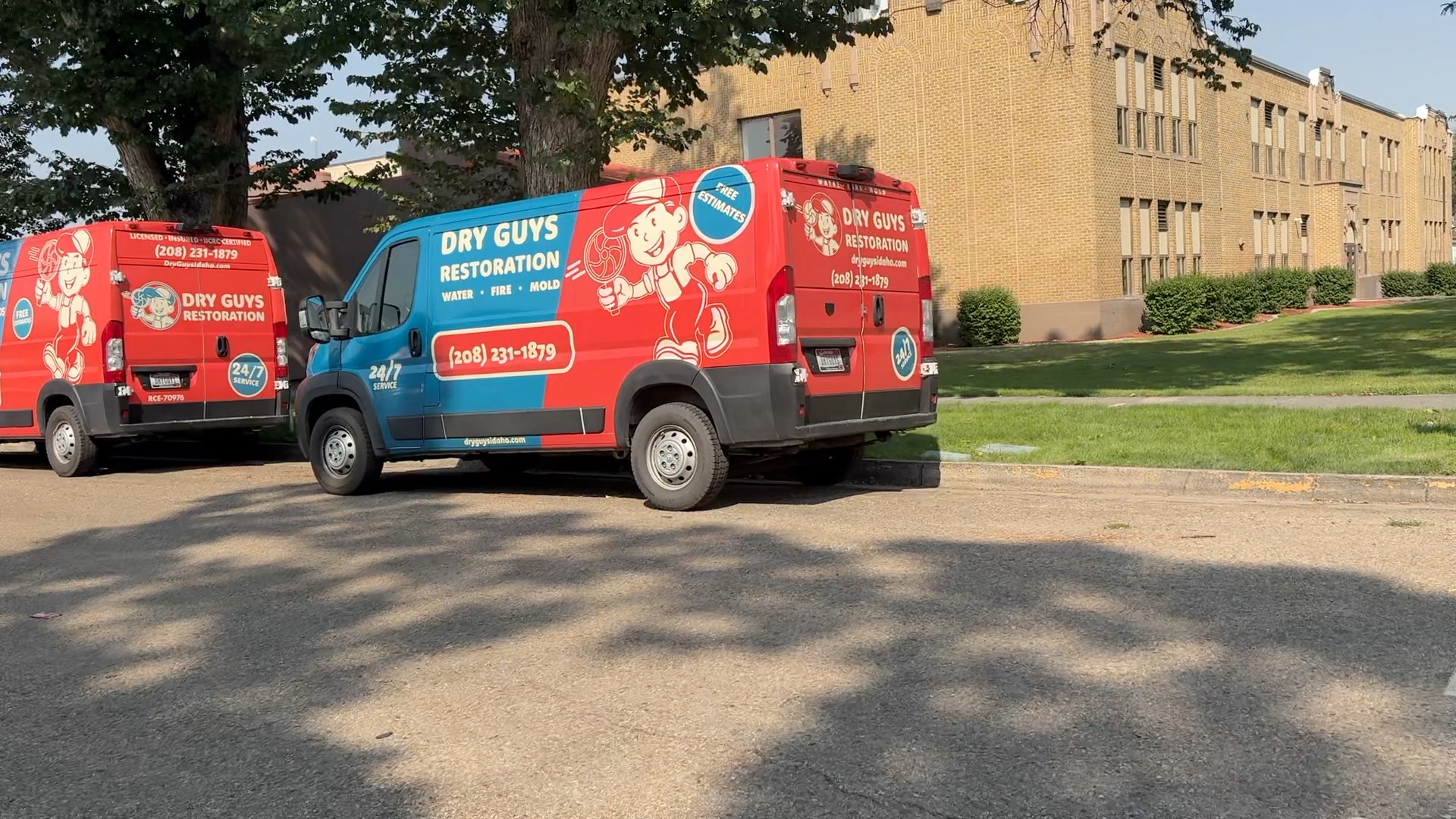 Restoration vans outside a flooded Central Elementary