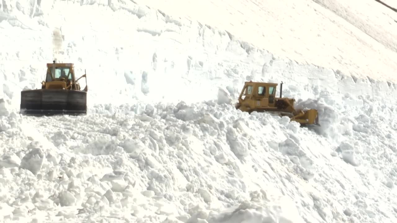 Crews plowing Glacier National Park's Going-to-the-Sun Road make it over Logan Pass