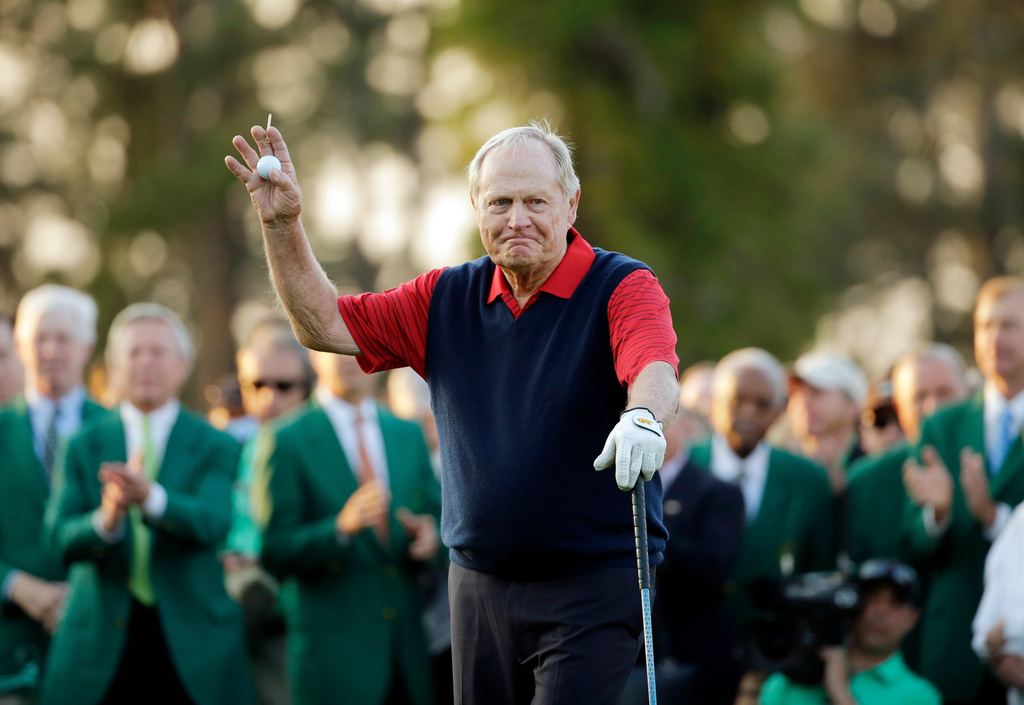 Jack Nicklaus waves before hitting the first tee for the honorary tee off before the first round of the Masters golf tournament, April 9, 2015, in Augusta, Ga.