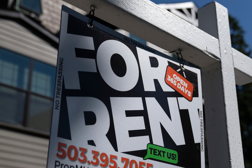 FILE - A sign reading "For Rent."