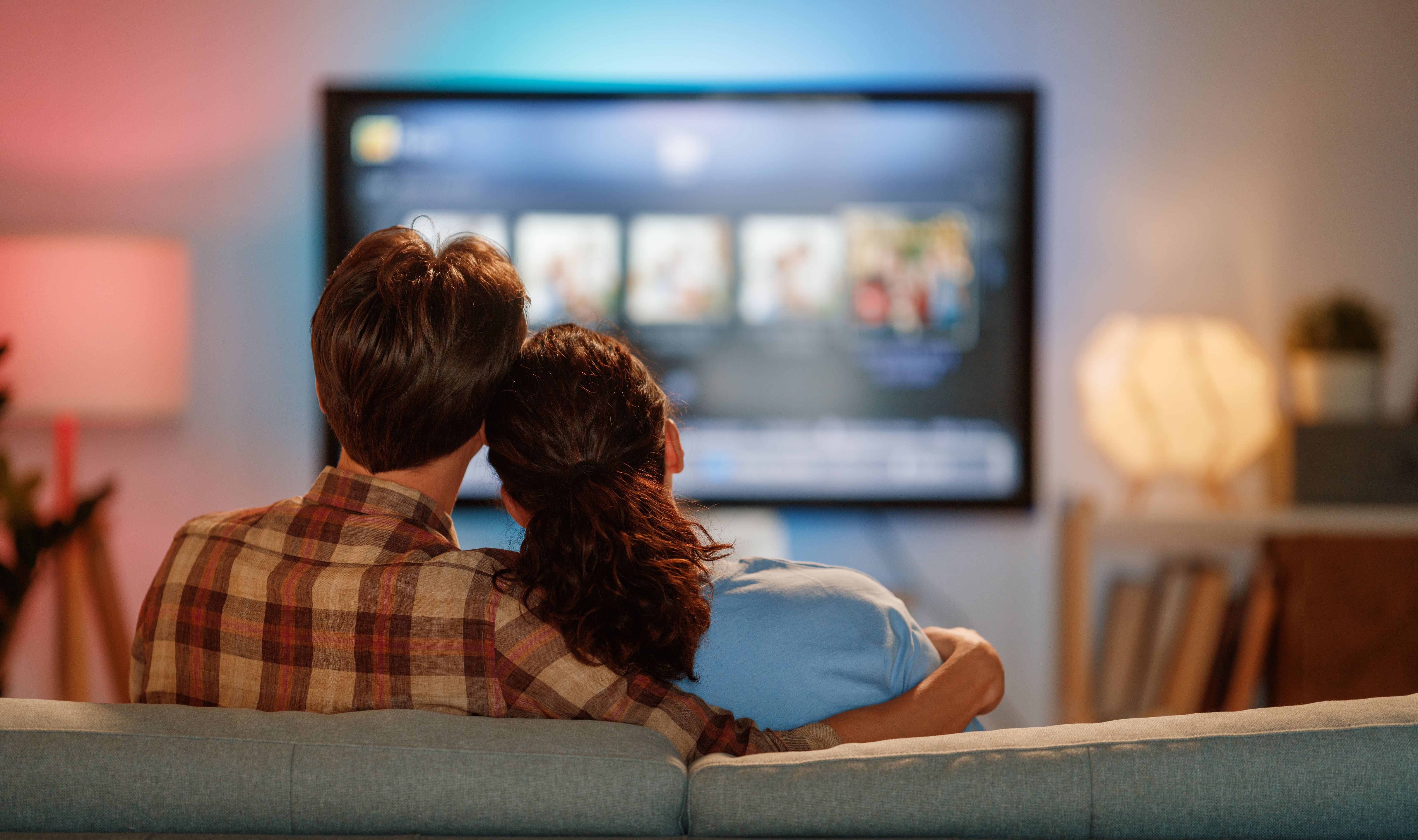 Happy,Family,Watching,Tv,,Movies,In,The,Evening,At,Home.
