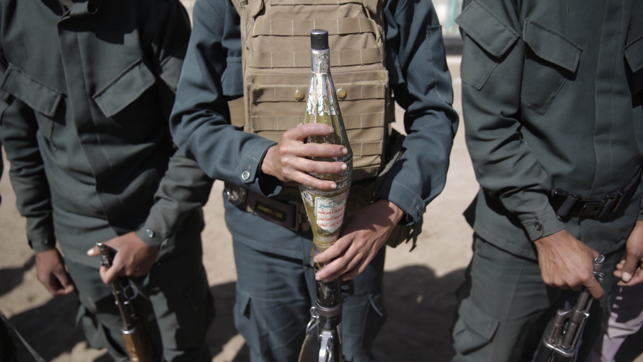 Houthi rebel fighters display their weapons during a gathering aimed at mobilizing more fighters for the Houthi movement