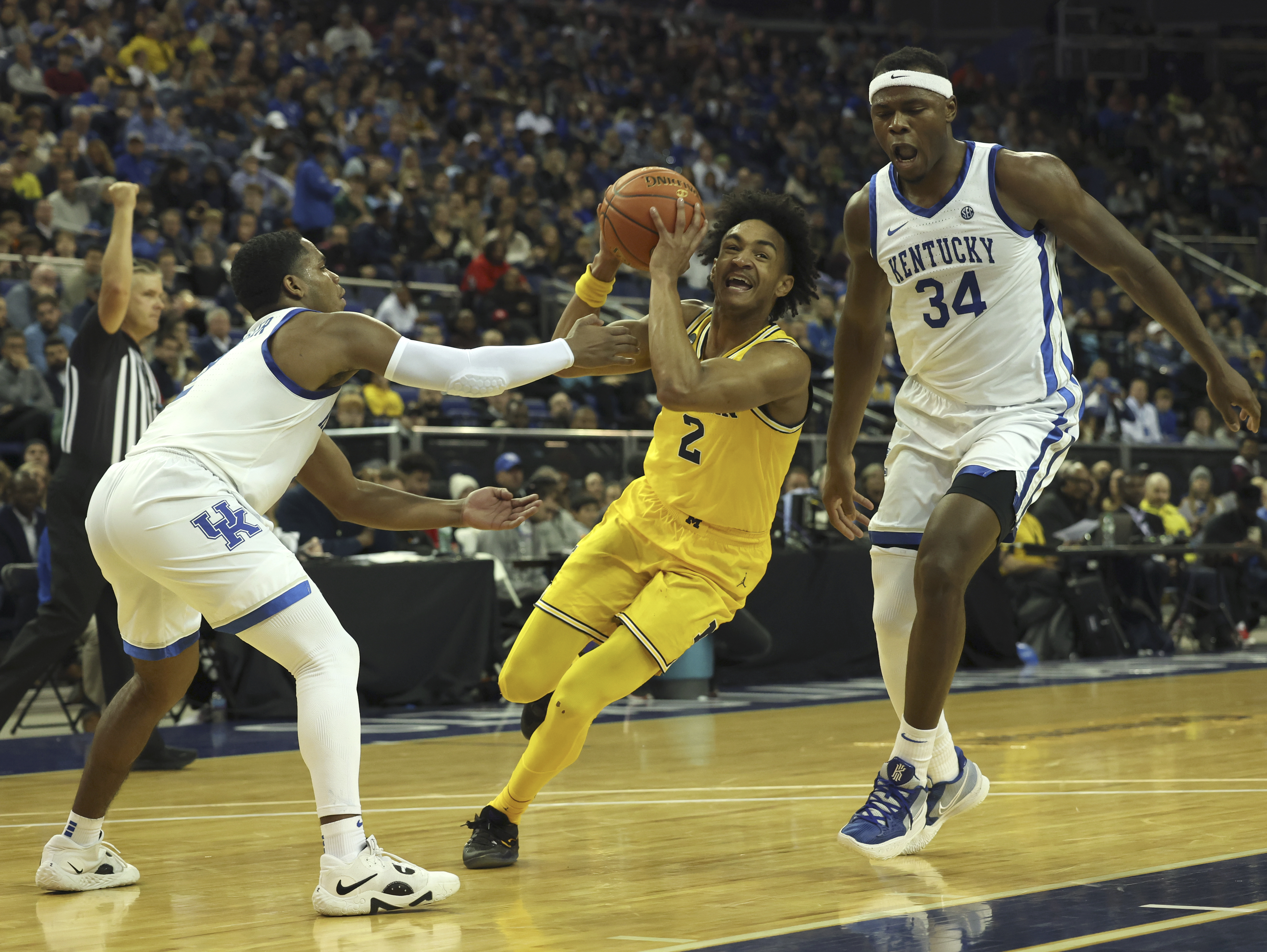Britain Basketball Michigan Kentucky