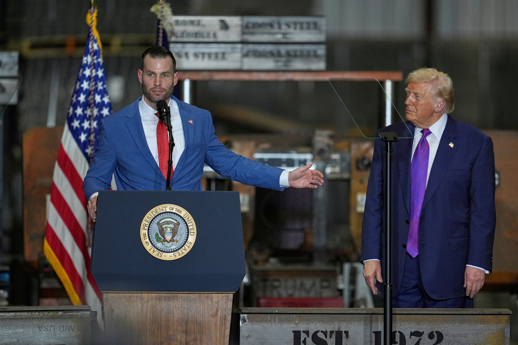 Congressional candidate Clay Fuller speaks as President Donald Trump listens at a rally at Coosa Steel Corporation in Rome, Ga., Thursday, Feb. 19, 2026. 