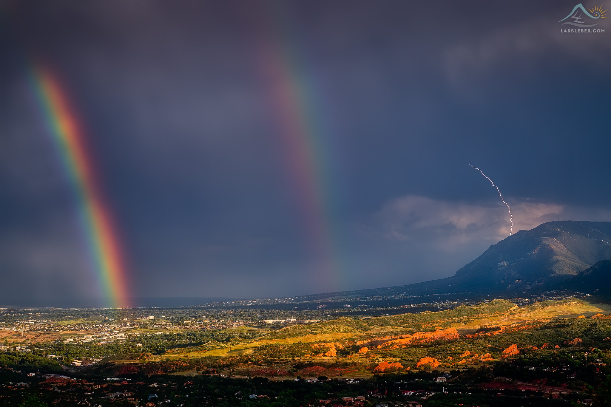 Rainbow storms Colorado Springs and Cheyenne Mountain Lars Leber