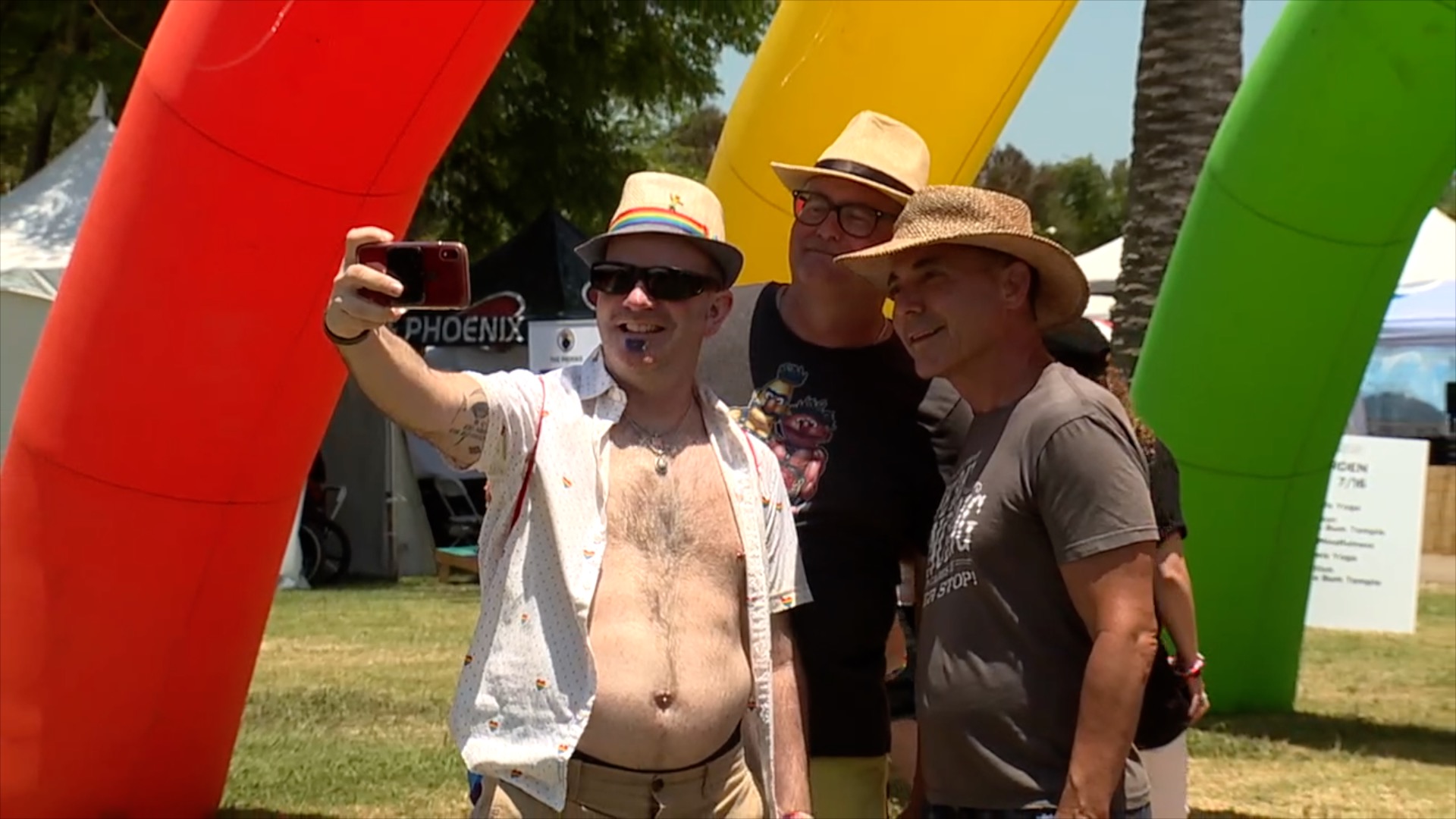 Many snap selfies as they enter the 2023 San Diego Pride Festival.
