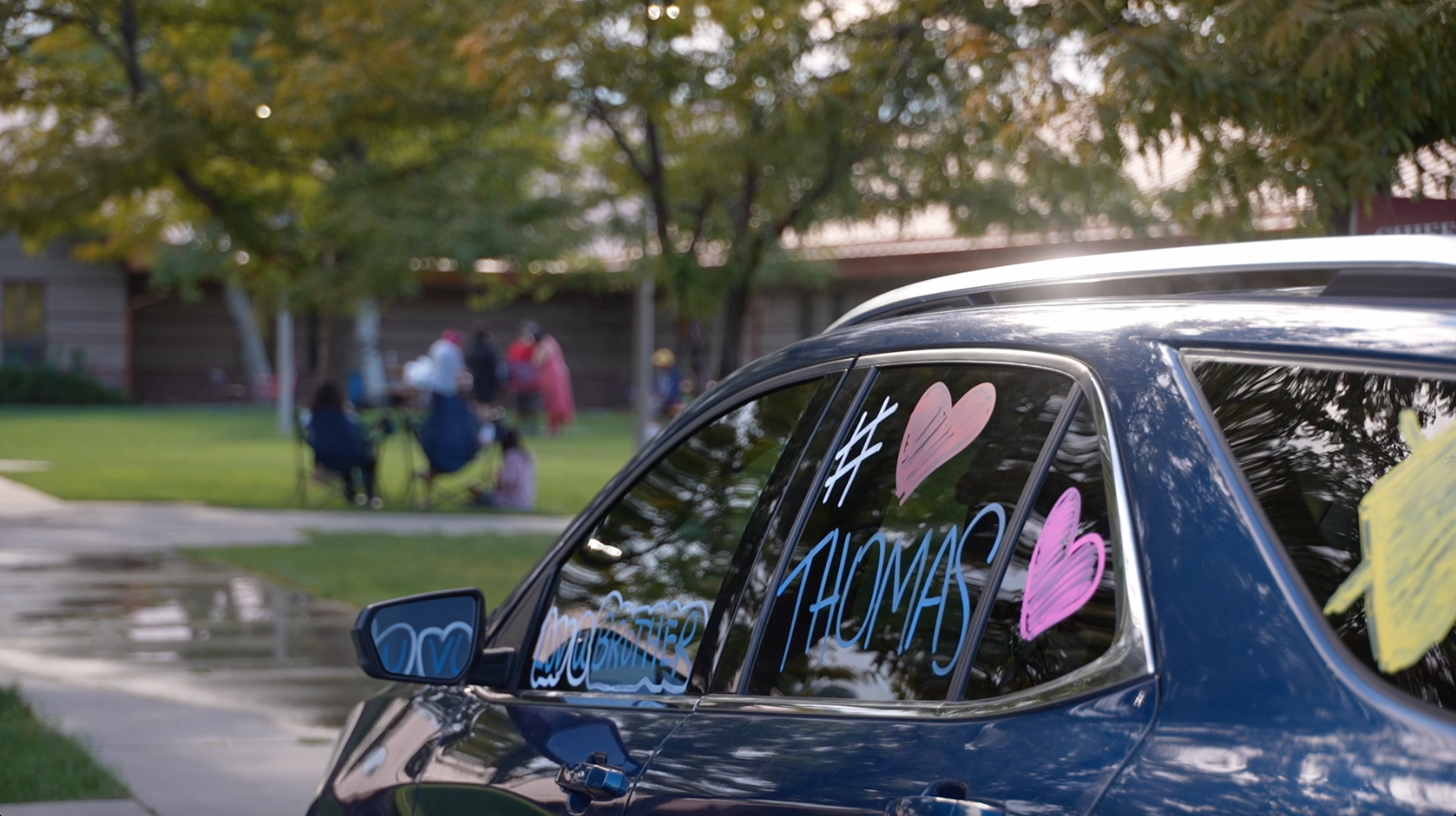 Family of Thomas Rockroads III decorate car 