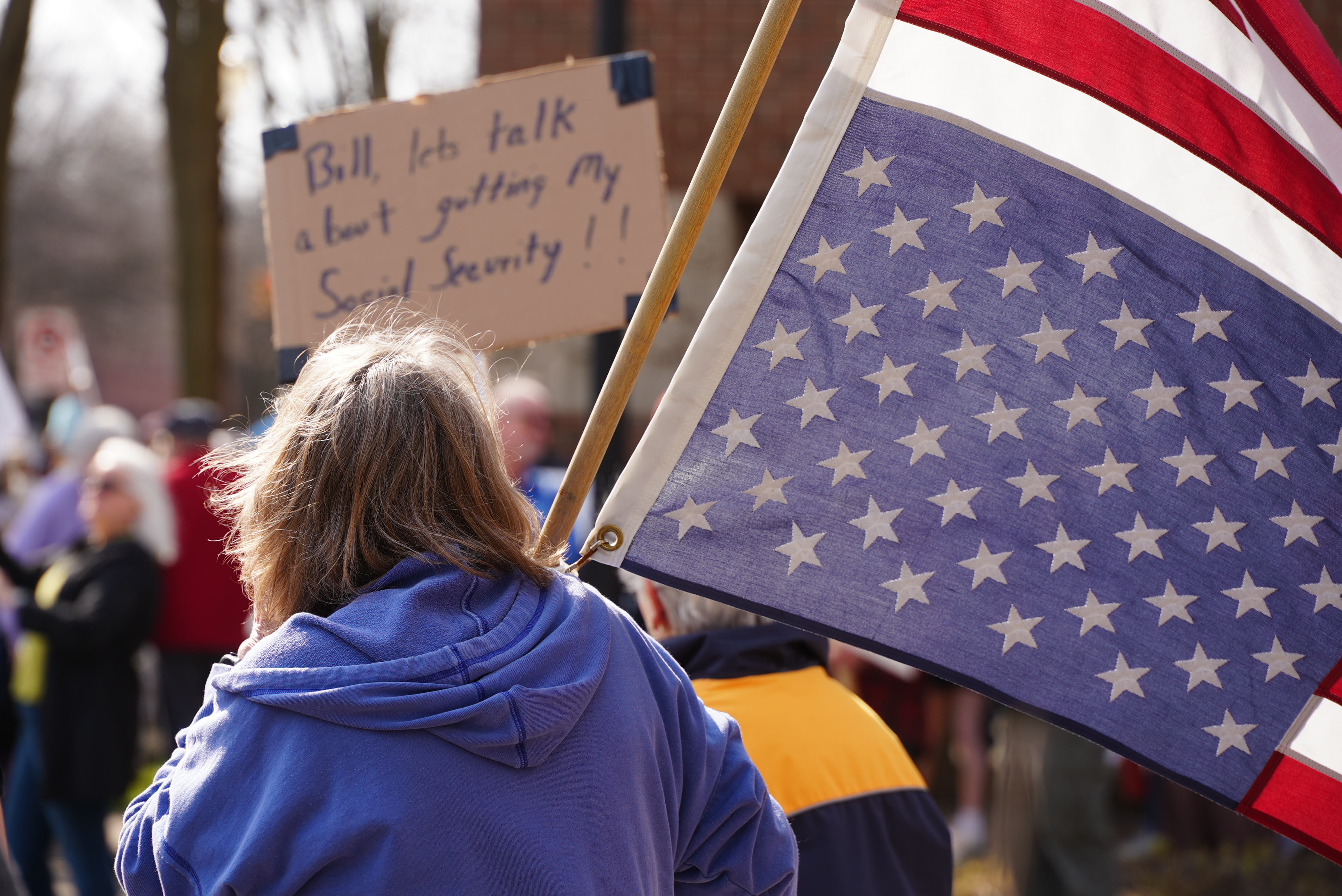 Protest outside of Rep. Bill Huizenga's office in Holland