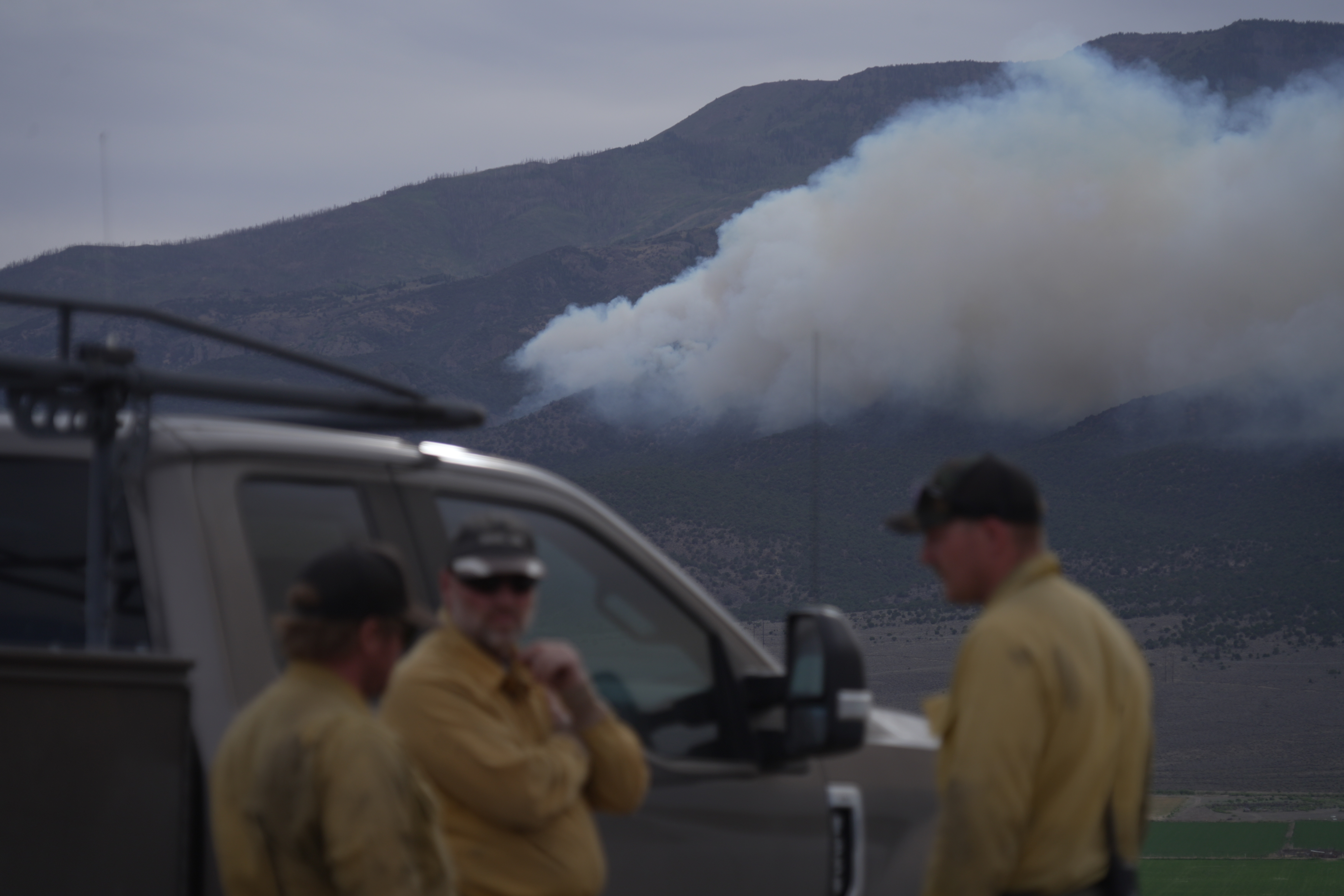 Firefighters gather near the Cottonwood Fire near Junction, Utah, on Friday, June 26, 2026.