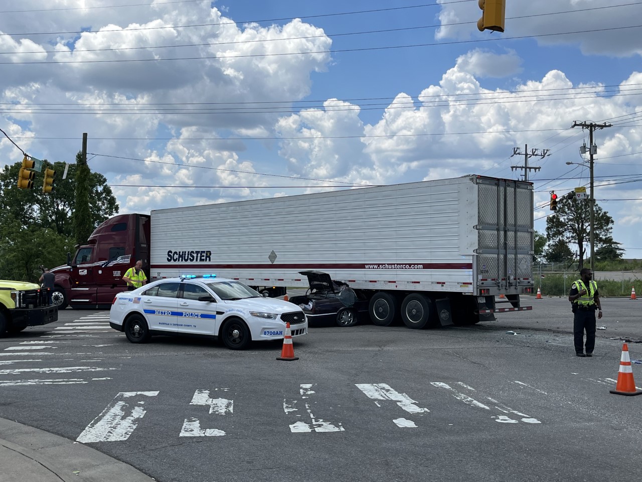 Wreck involving semi-trailer truck and a Cadillac