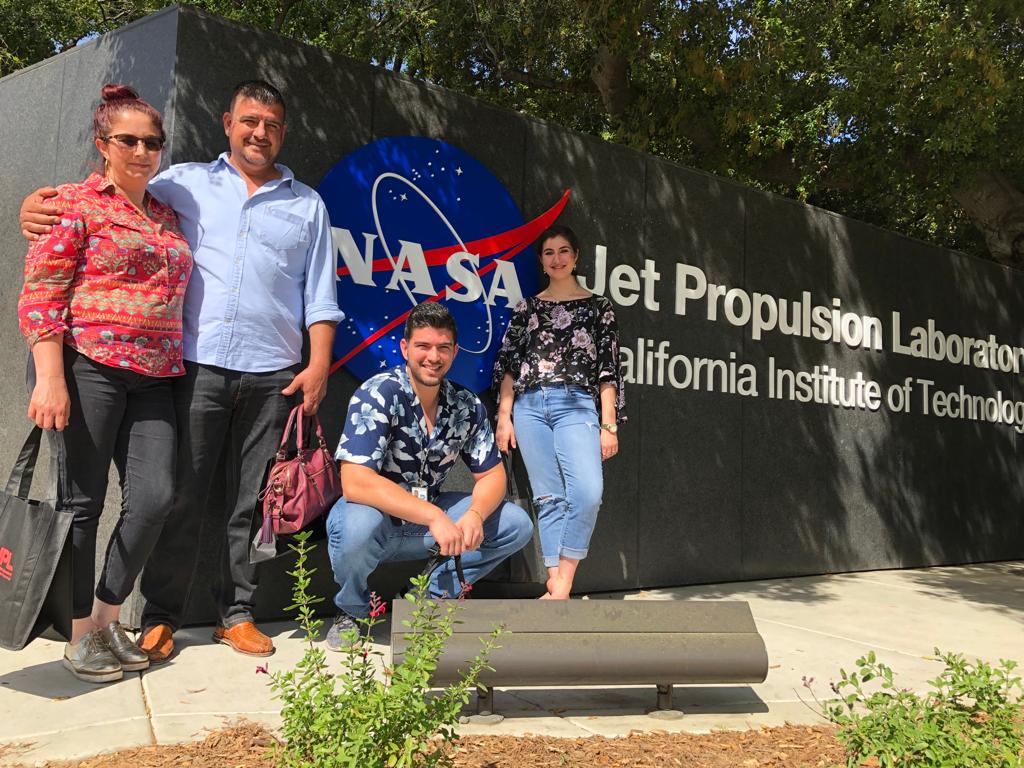 USC graduate Jesus Ojeda with his family outside of a NASA laboratory where he did an internship.