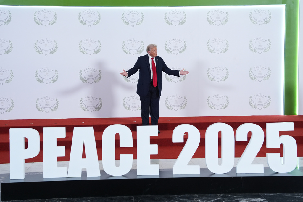 President Donald Trump waits to greet leaders during a summit to support ending the more than two-year Israel-Hamas war in Gaza after a breakthrough ceasefire deal, Monday, Oct. 13, 2025, in Sharm El Sheikh, Egypt. 