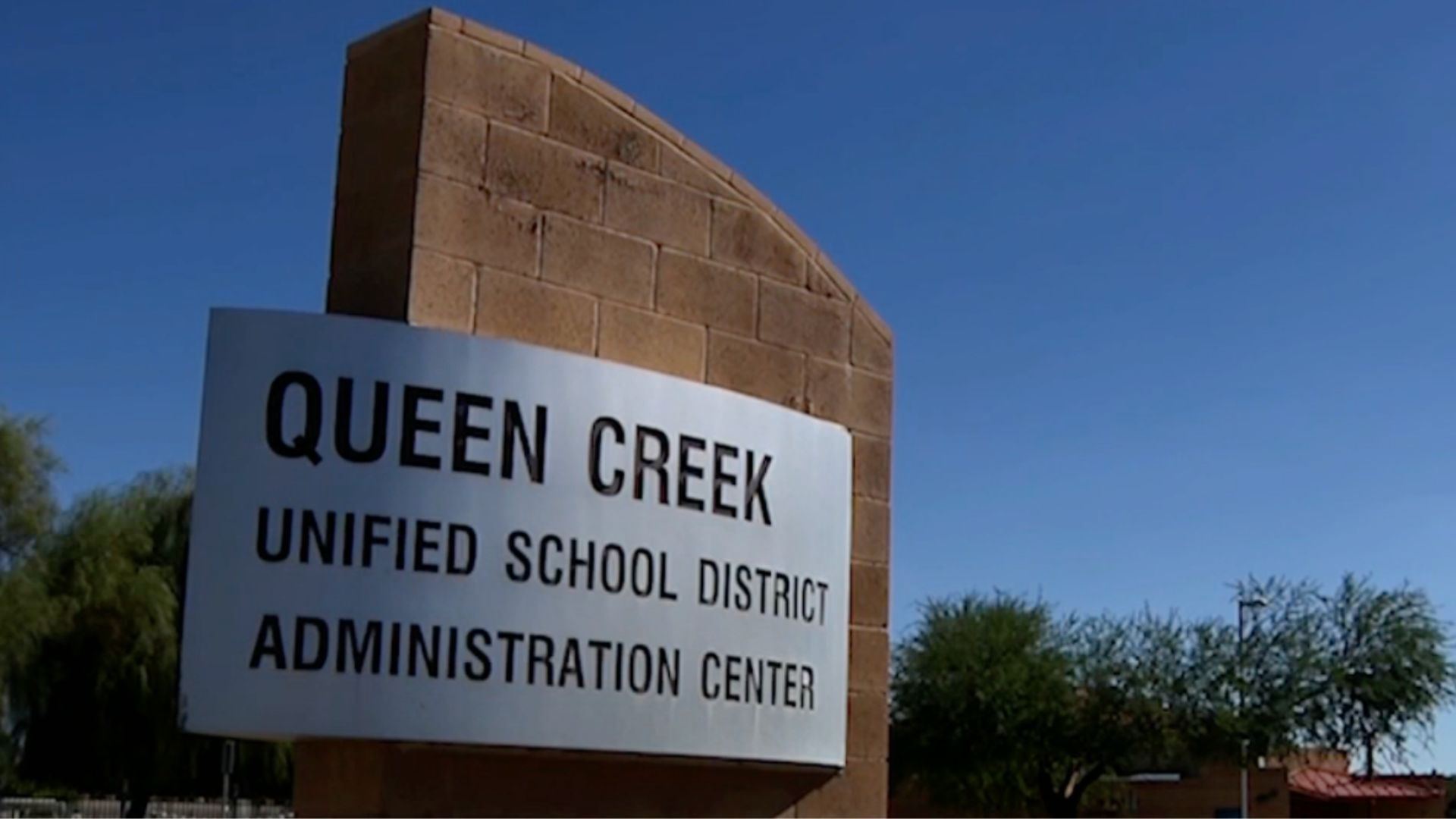 A sign for the Queen Creek Unified School District Administration Center.
